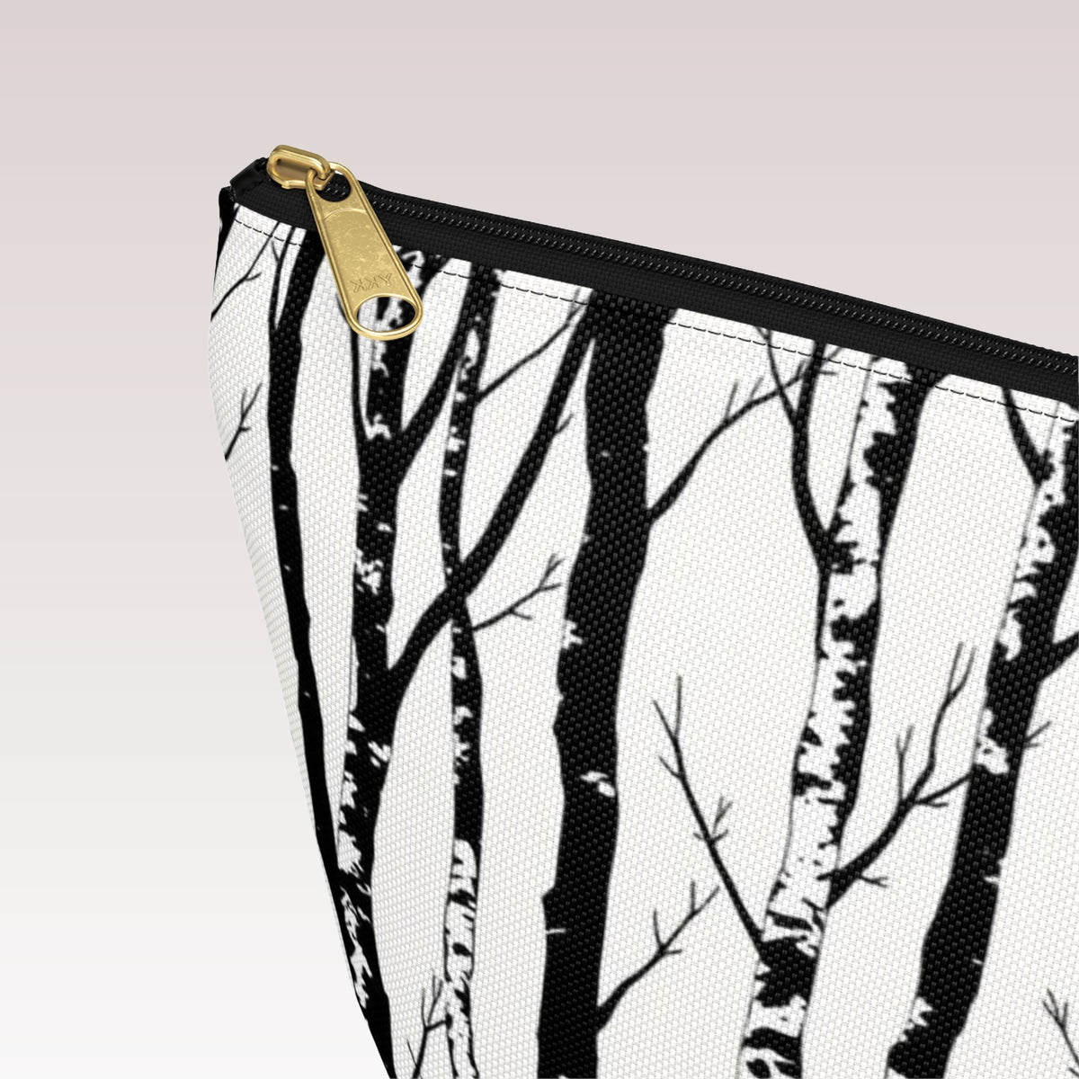 Decorative toiletry bag with a black zipper and a gold-tone zipper pull.