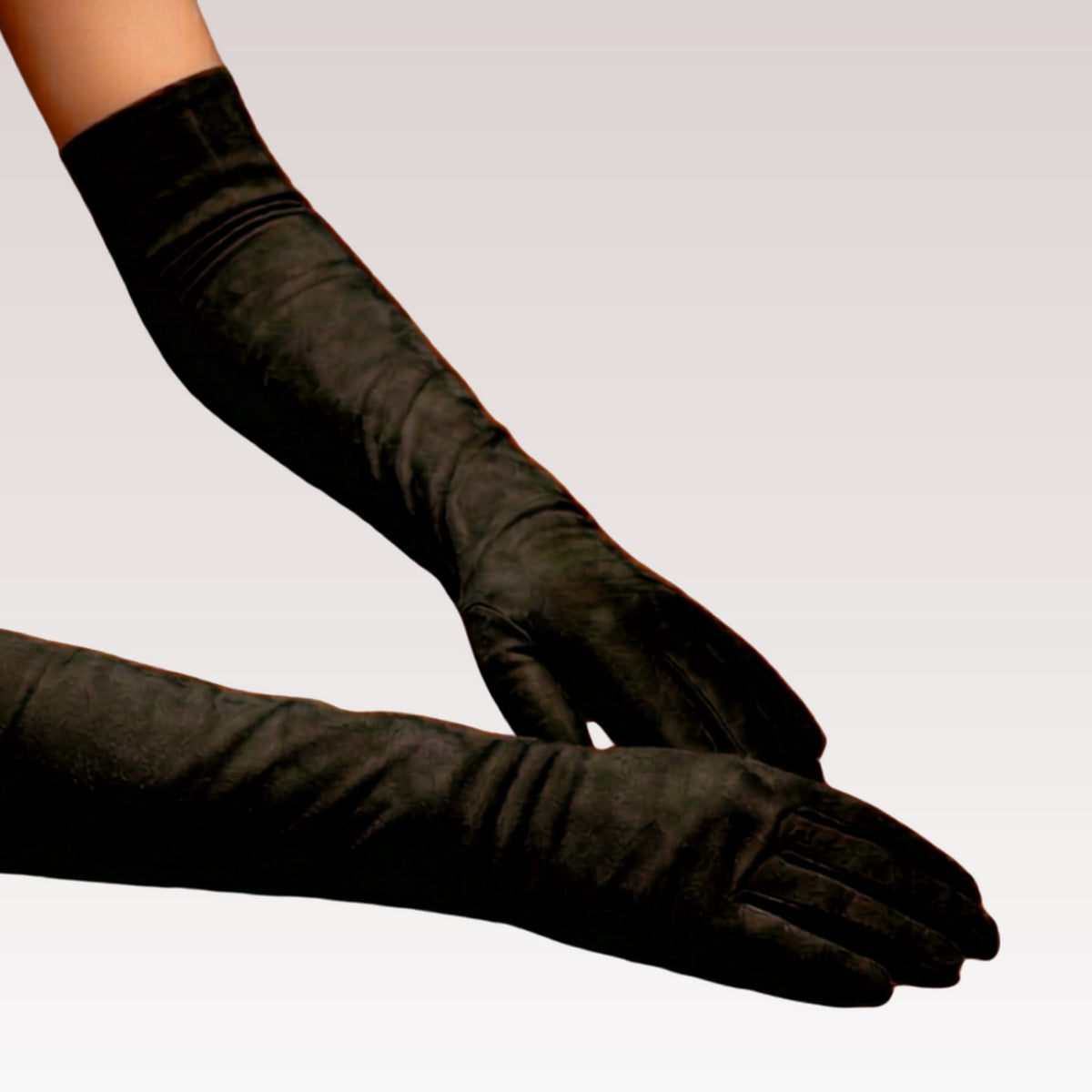 A pair of long opera gloves worn on two hands.
