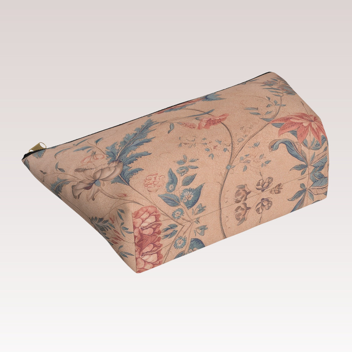 Decorative toiletry bag with a black zipper and a gold-tone zipper pull.